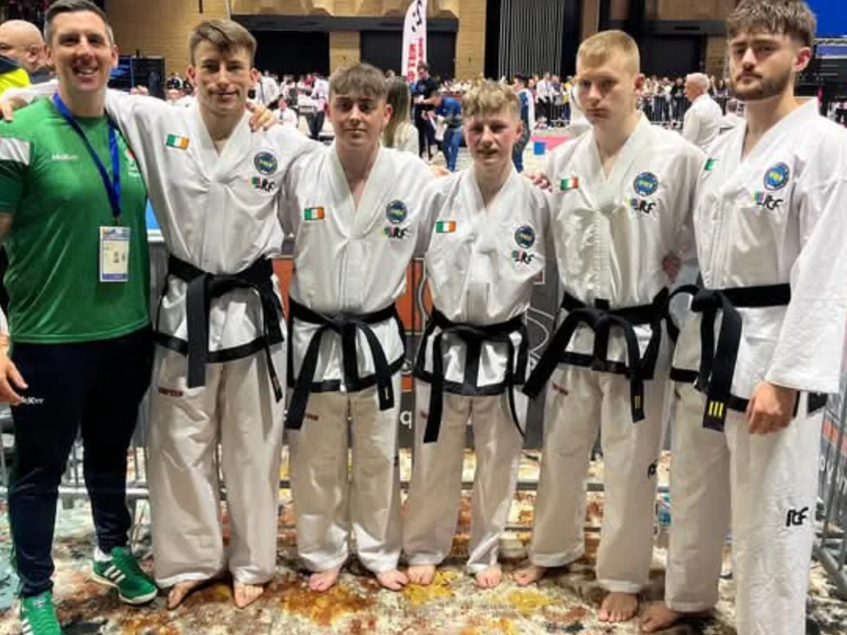 Junior squad with their coach at an international championship venue